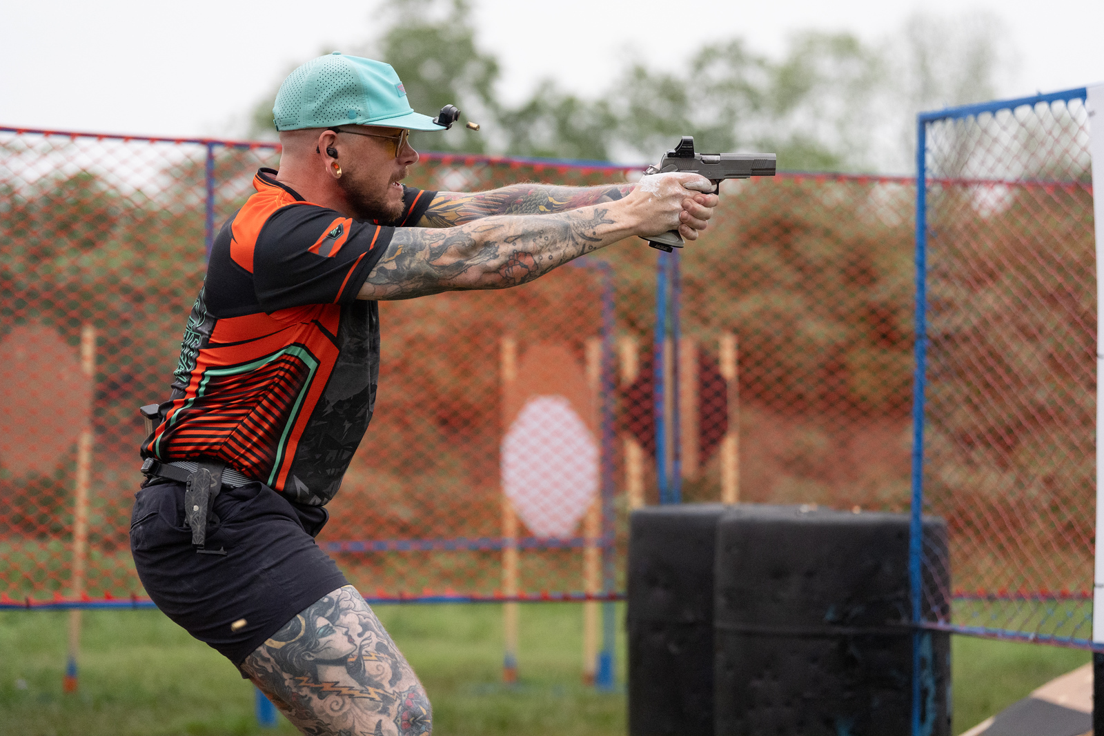Competitive shooter running a stage at a major match